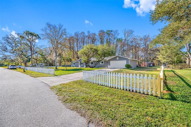 exterior space with a garage and a yard