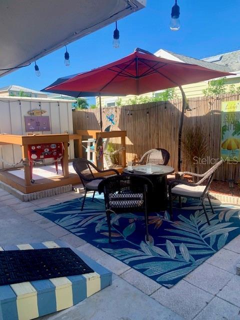 view of patio / terrace with a storage shed