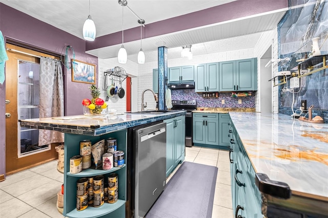 kitchen with pendant lighting, sink, tasteful backsplash, light tile patterned flooring, and stainless steel appliances