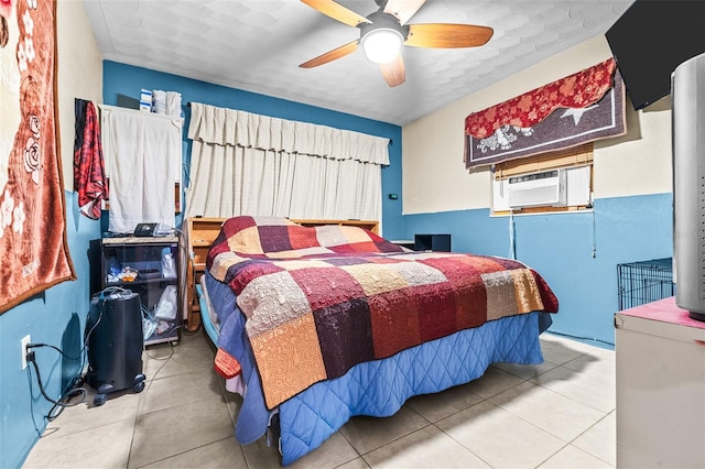 tiled bedroom with ceiling fan and cooling unit