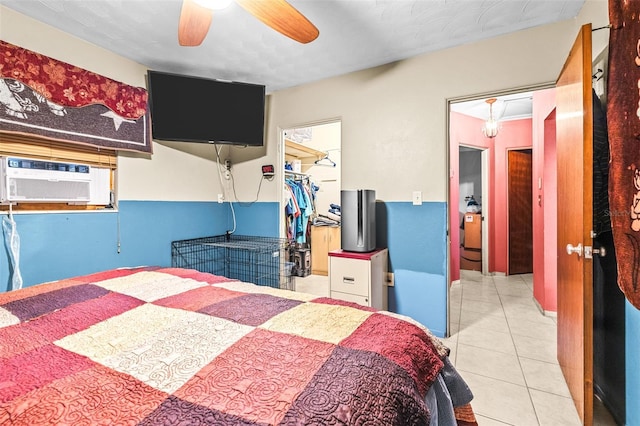 bedroom featuring cooling unit, ceiling fan, a spacious closet, a closet, and light tile patterned flooring