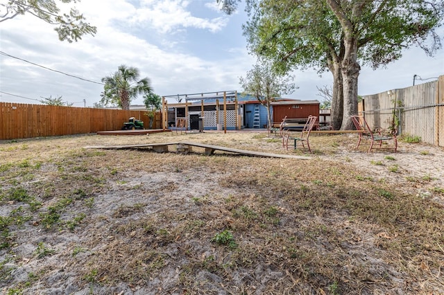 view of yard with a wooden deck