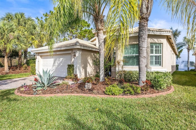 view of side of property featuring a yard and a garage