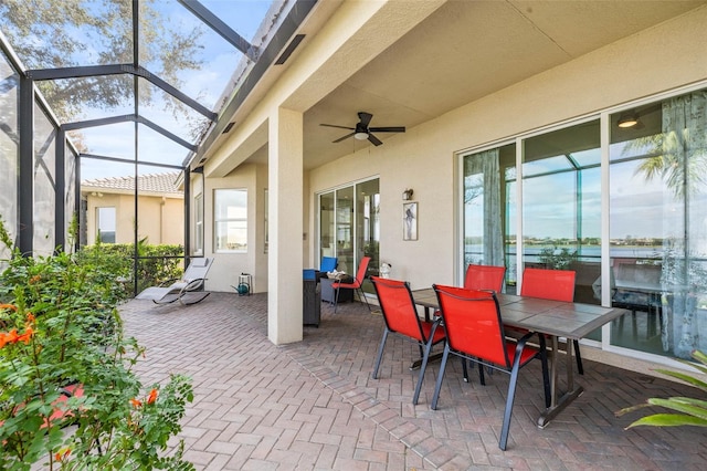 view of patio / terrace with a lanai and ceiling fan