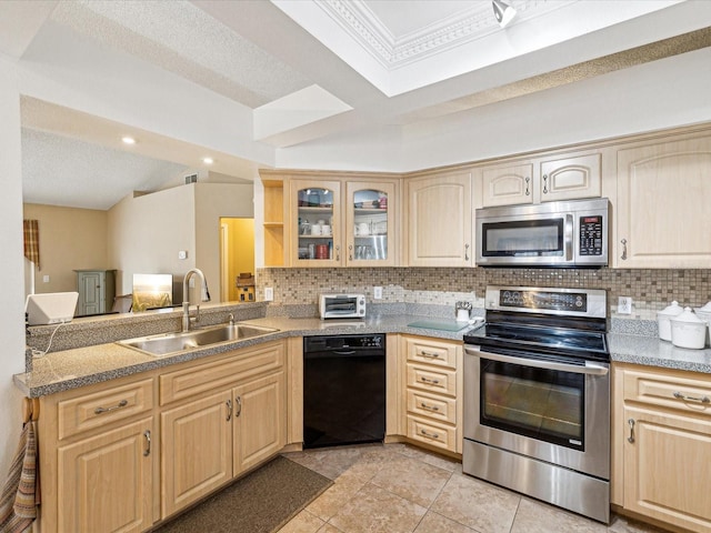 kitchen with tasteful backsplash, sink, stainless steel appliances, and light brown cabinets