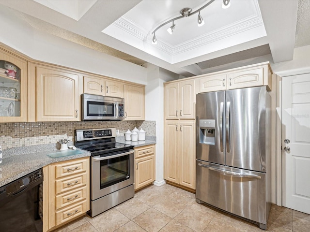 kitchen with light brown cabinetry, stainless steel appliances, light tile patterned floors, and tasteful backsplash