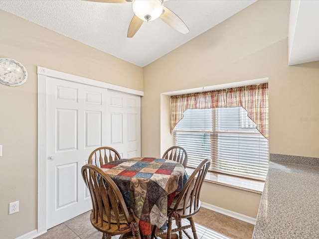 tiled dining room with ceiling fan