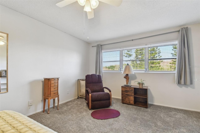 carpeted bedroom featuring a textured ceiling and ceiling fan