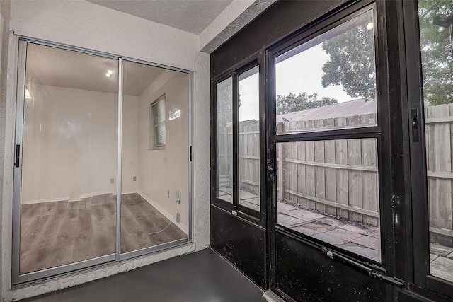 entryway featuring a textured ceiling