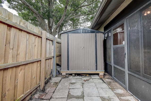 view of patio / terrace featuring a shed