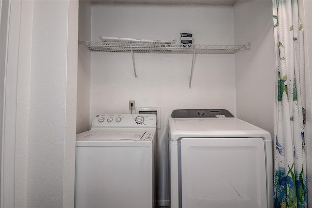 laundry room featuring washer and clothes dryer