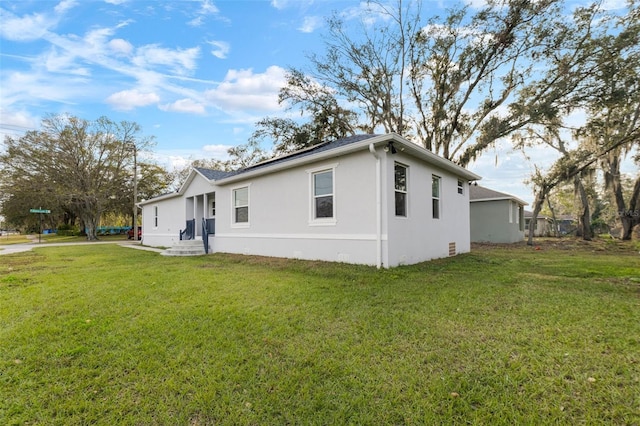 view of home's exterior featuring a lawn