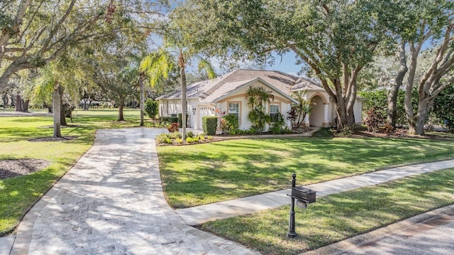 view of front of property with a front lawn