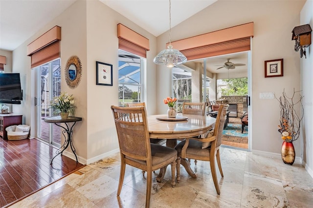 dining room with vaulted ceiling and ceiling fan