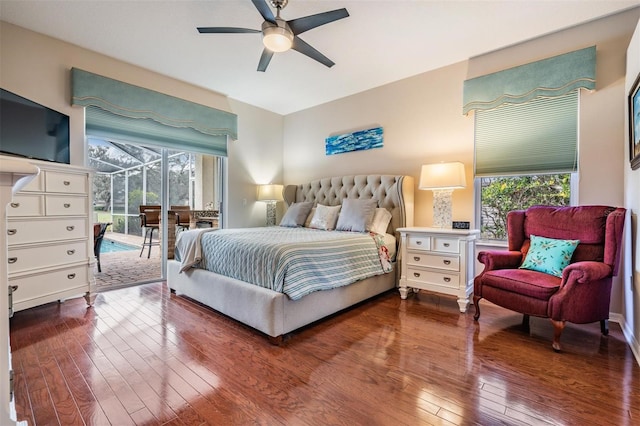 bedroom with ceiling fan, access to exterior, wood-type flooring, and multiple windows