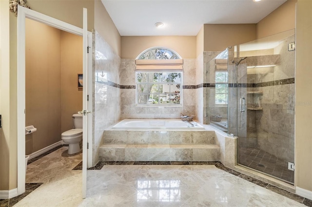 bathroom with shower with separate bathtub and toilet