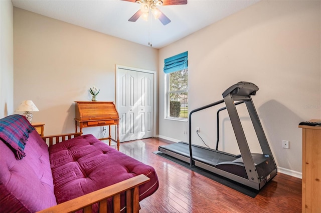 workout room with hardwood / wood-style flooring and ceiling fan