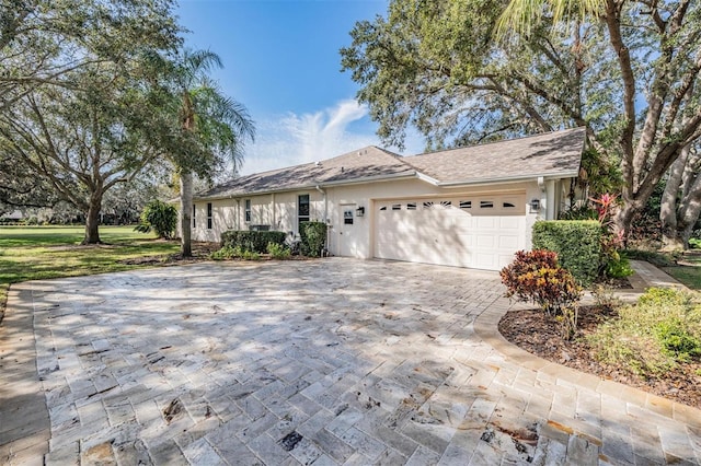 single story home featuring a garage