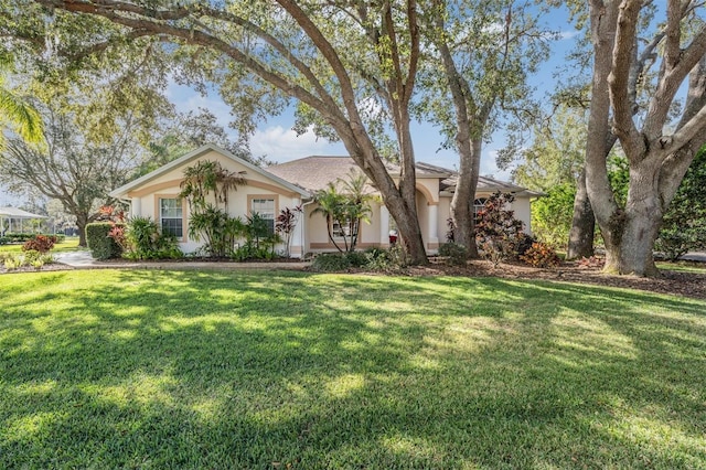 single story home featuring a front yard