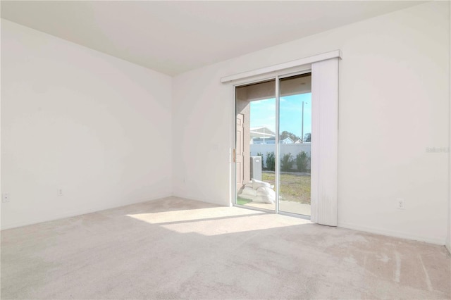 empty room featuring light carpet