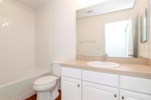 full bathroom with vanity, toilet, shower / bath combination, and wood-type flooring