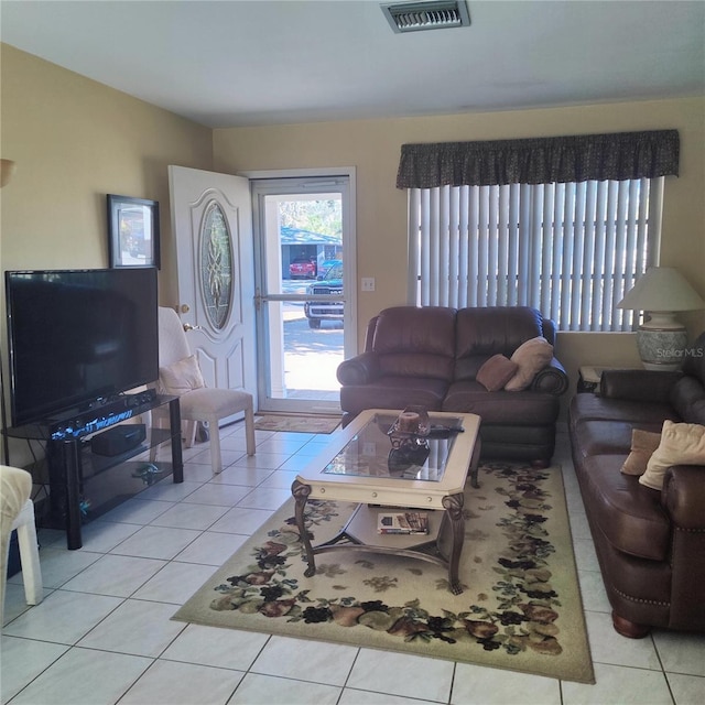 living room with light tile patterned floors