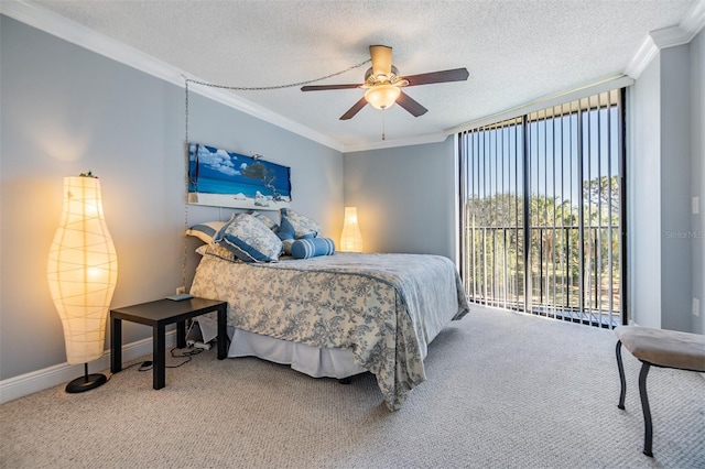 bedroom featuring ceiling fan, a textured ceiling, access to outside, carpet, and ornamental molding