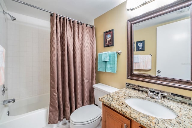 full bathroom with toilet, vanity, and shower / tub combo with curtain