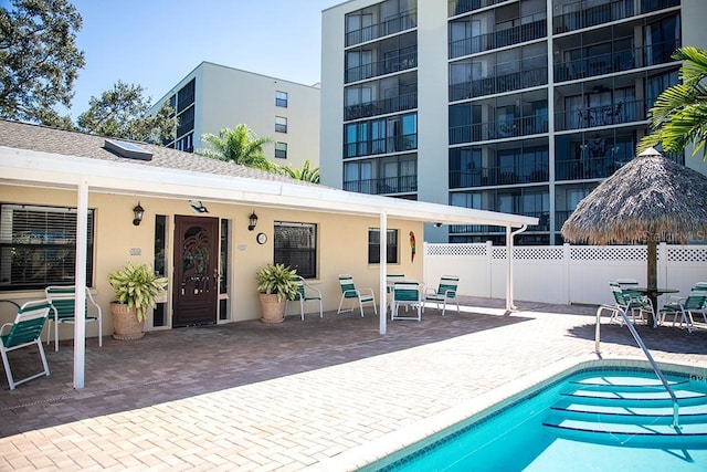 view of swimming pool with a patio