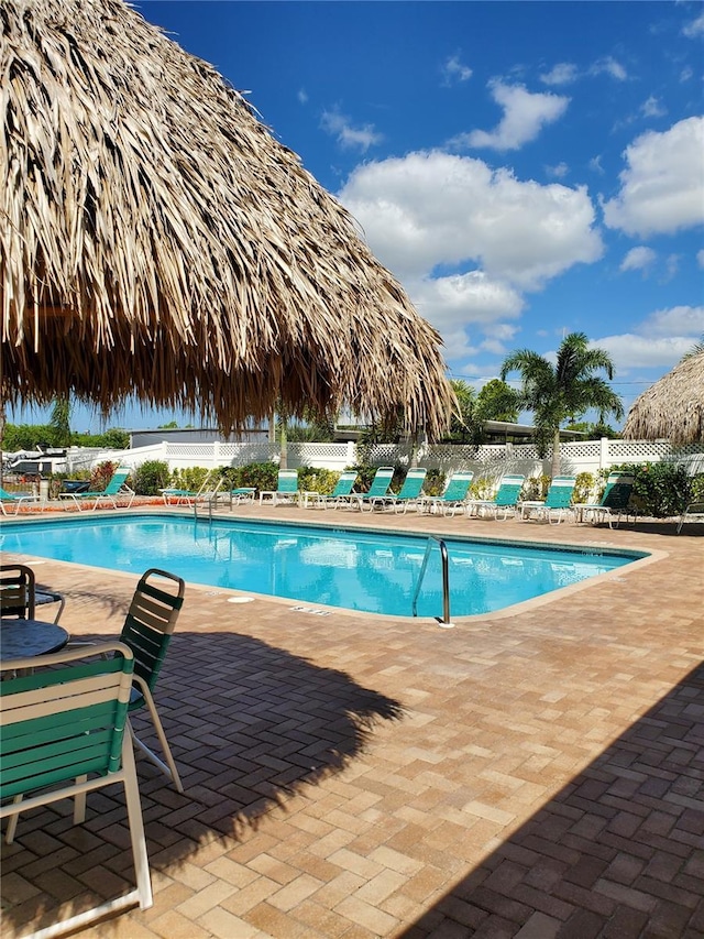 view of swimming pool with a patio area