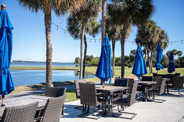 view of patio with a water view