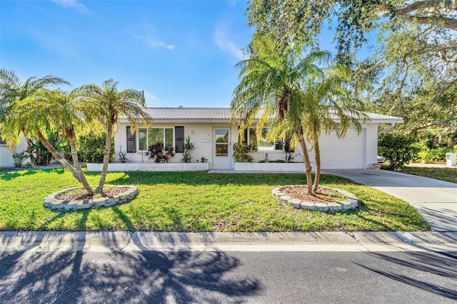 ranch-style home featuring a garage and a front yard