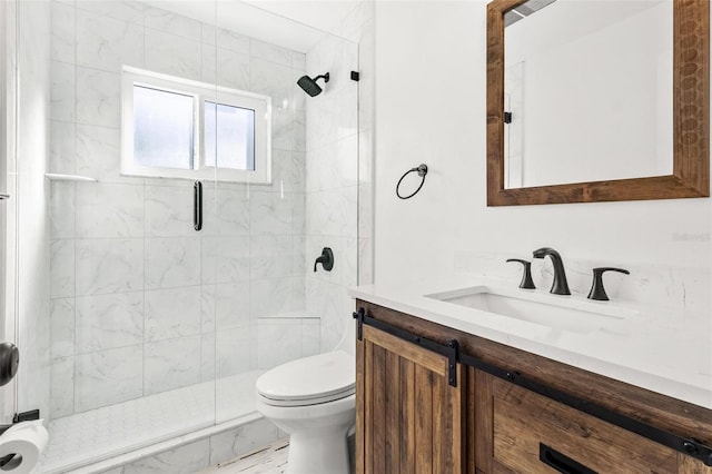 bathroom featuring vanity, toilet, and walk in shower