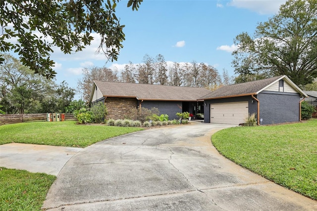 ranch-style home with a front yard and a garage