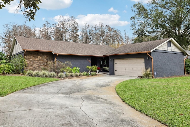 ranch-style home with a garage and a front lawn