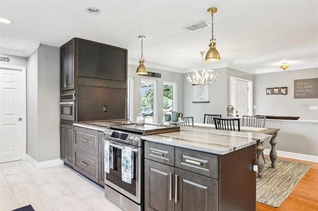 kitchen featuring dark brown cabinets, crown molding, light stone countertops, and stainless steel appliances