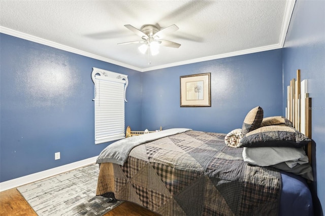 bedroom with wood-type flooring, a textured ceiling, ceiling fan, and crown molding