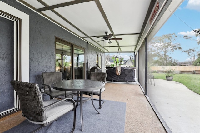 sunroom with ceiling fan and a healthy amount of sunlight