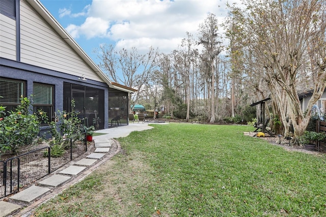 view of yard featuring a sunroom