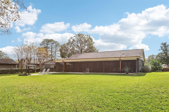 view of yard with a patio area and a sunroom