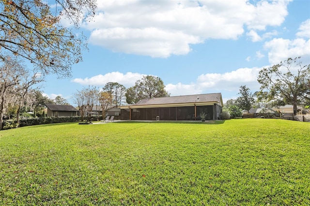 view of yard with a sunroom