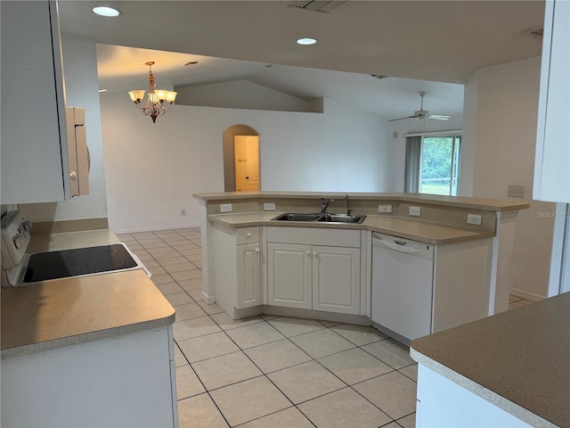 kitchen featuring dishwasher, range, sink, hanging light fixtures, and white cabinetry