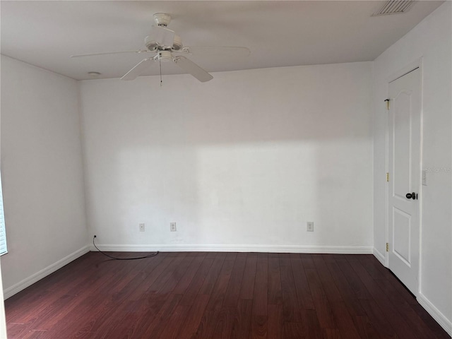 unfurnished room featuring dark hardwood / wood-style flooring and ceiling fan