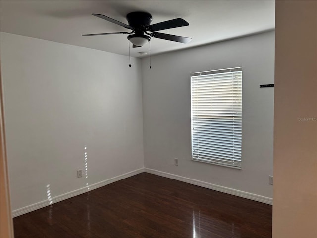 unfurnished room featuring ceiling fan and dark wood-type flooring