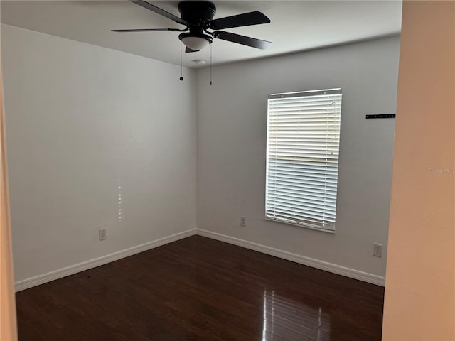 unfurnished room with dark hardwood / wood-style floors and ceiling fan