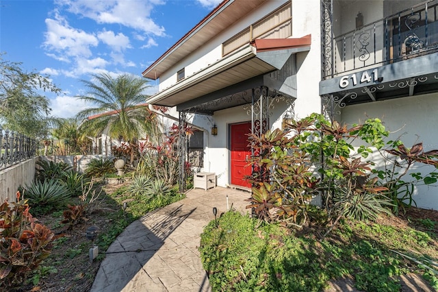 property entrance featuring a patio area