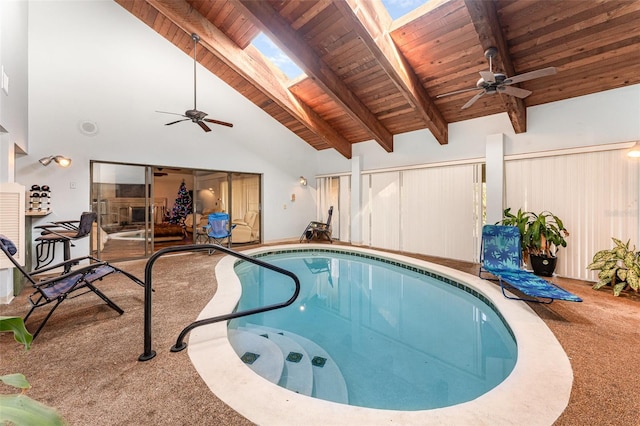 view of pool with a hot tub and a skylight