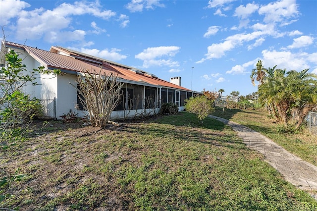 view of yard with a sunroom