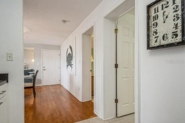 hallway with light tile patterned floors