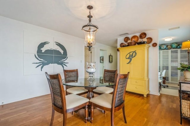 dining space featuring hardwood / wood-style flooring